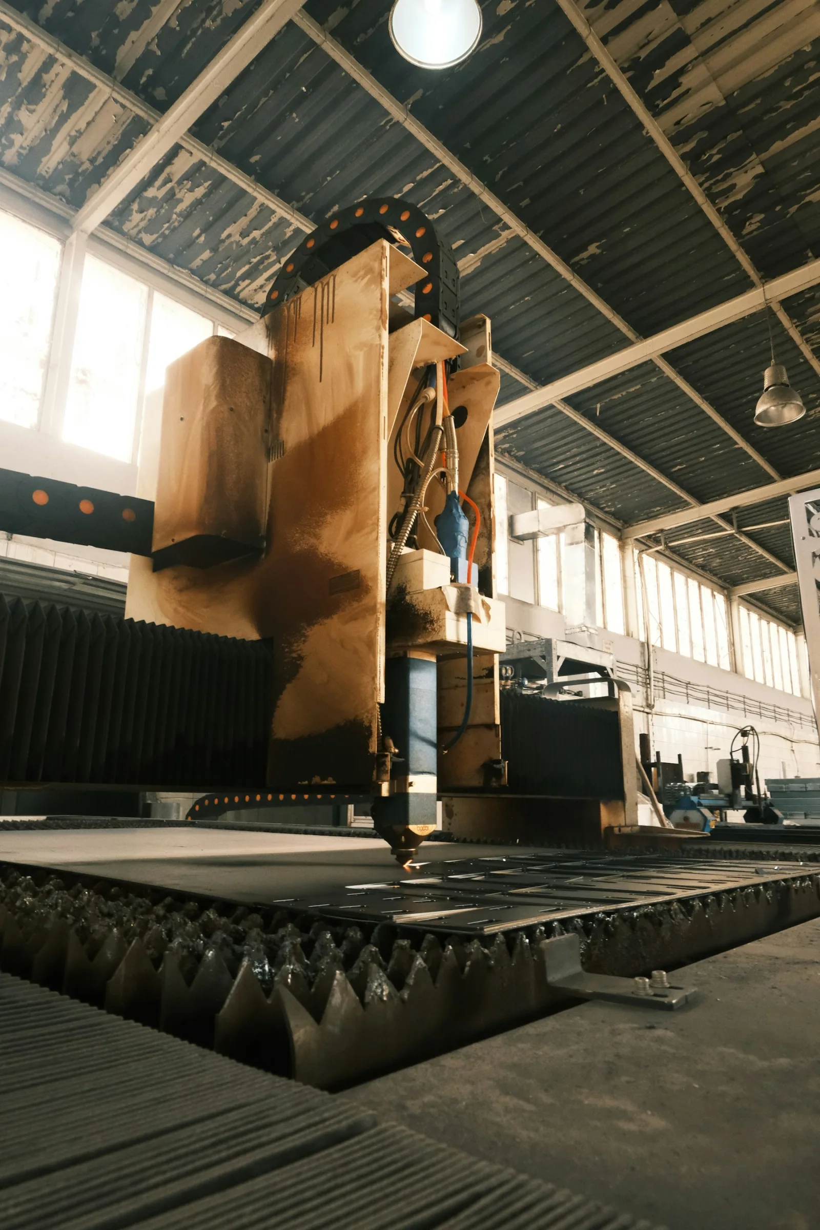 Sheet-metal cutting machine in the Bethora fabrication bay